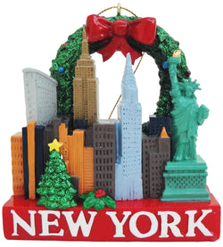 A Christmas Ornament showcasing famous landmarks from New York City, like the statue of liberty, the Empire State Building, and the famous New York skyline. On the bottom is written New York.