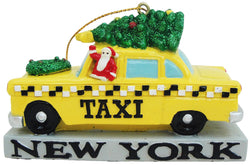 A X-mas or Christmas ornament with a yellow taxi with a Christmas three on top.