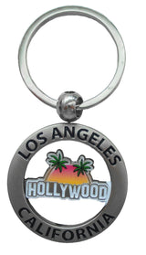 Los Angeles Key chain with writing that says Los Angeles California across a circle and Hollywood in the middle, and sunset with palm trees in the background.