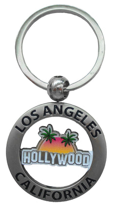 Los Angeles Key chain with writing that says Los Angeles California across a circle and Hollywood in the middle, and sunset with palm trees in the background.