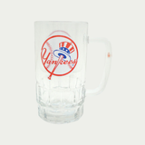 Yankees beer glass, see through glass beer with Yankees logo in the middle.