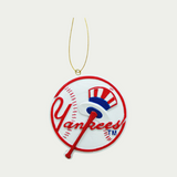 Yankees Christmas Ornament. This Ornament is in the shape of a baseball with Yankees written on it in red, and a baseball bat with a hat on it