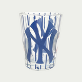Yankees shot glass with blue stripes all over and NY Yankees Logo in the middle