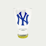 Yankees shot glass with yankees logo in the middle.